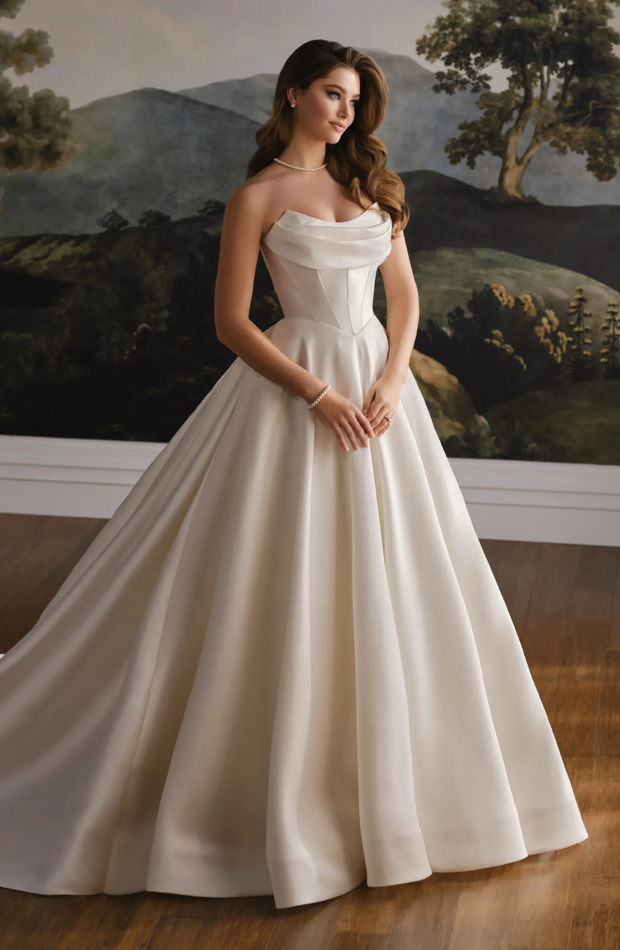 model is wearing a strapless basque waist ball gown