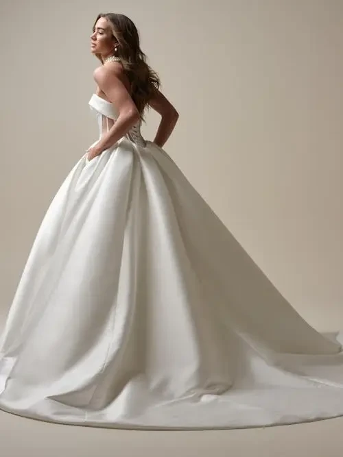 Why Statement Sleeves and Minimalist Gowns Are Trending in 2026 Bridal Fashion - Jaclyn’s Bridal... Image