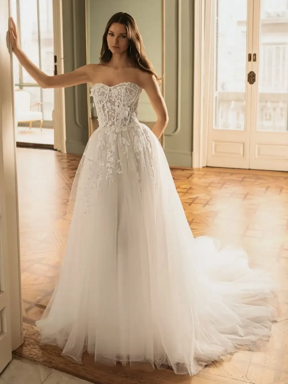 model is wearing a strapless a-line bridal gown