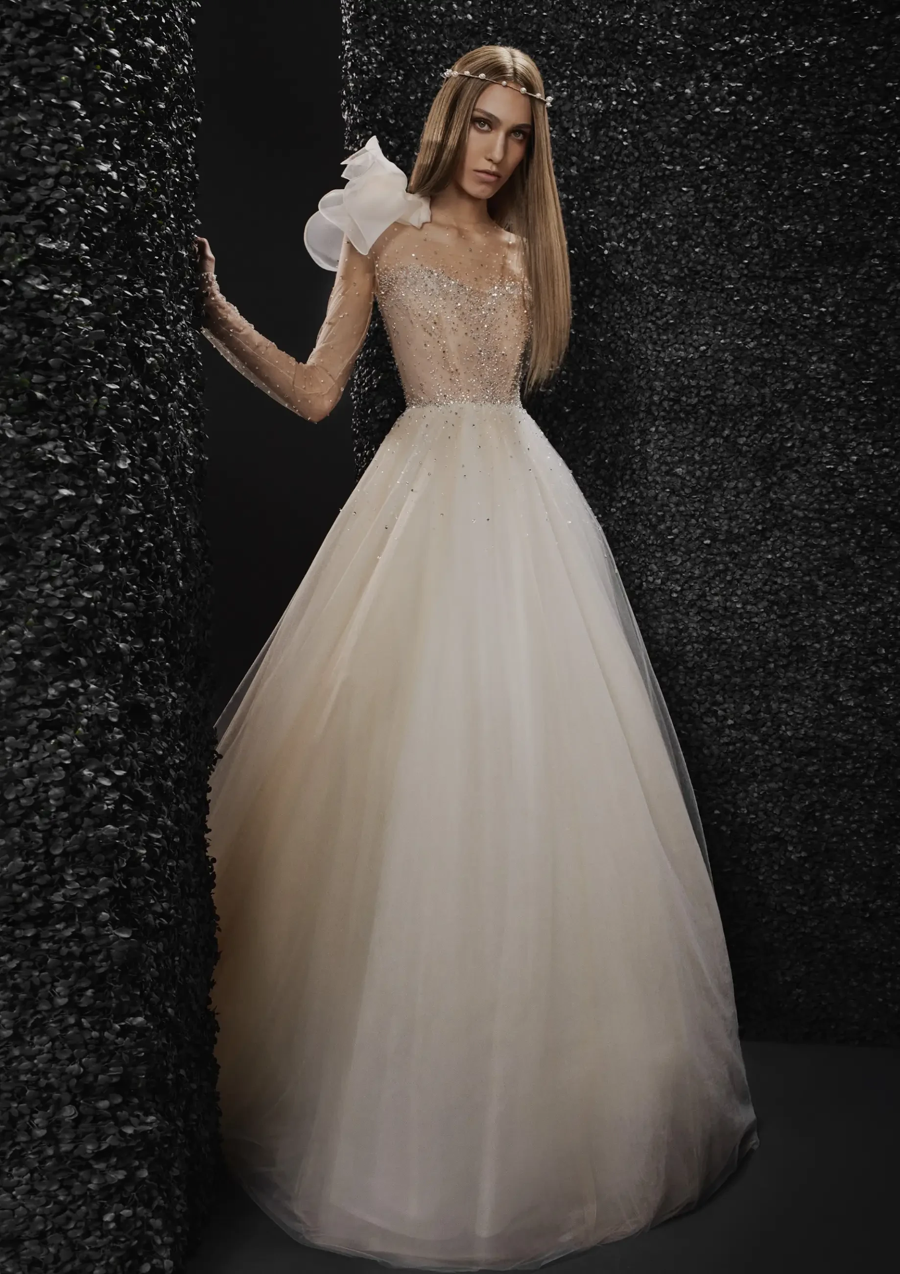 model is wearing a tulle a-line wedding dress by vera wang
