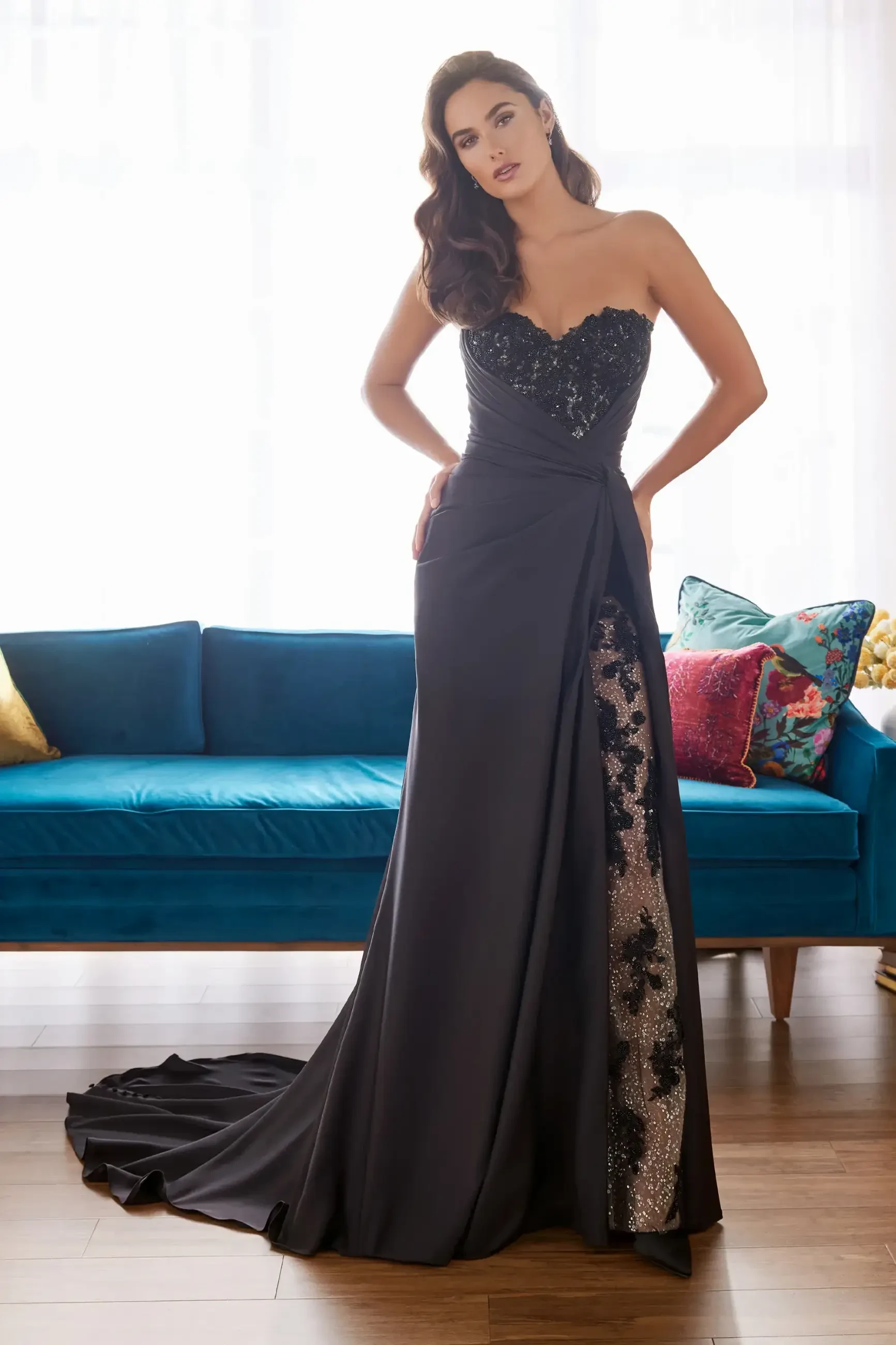 model is wearing a sleek black lace bridal gown