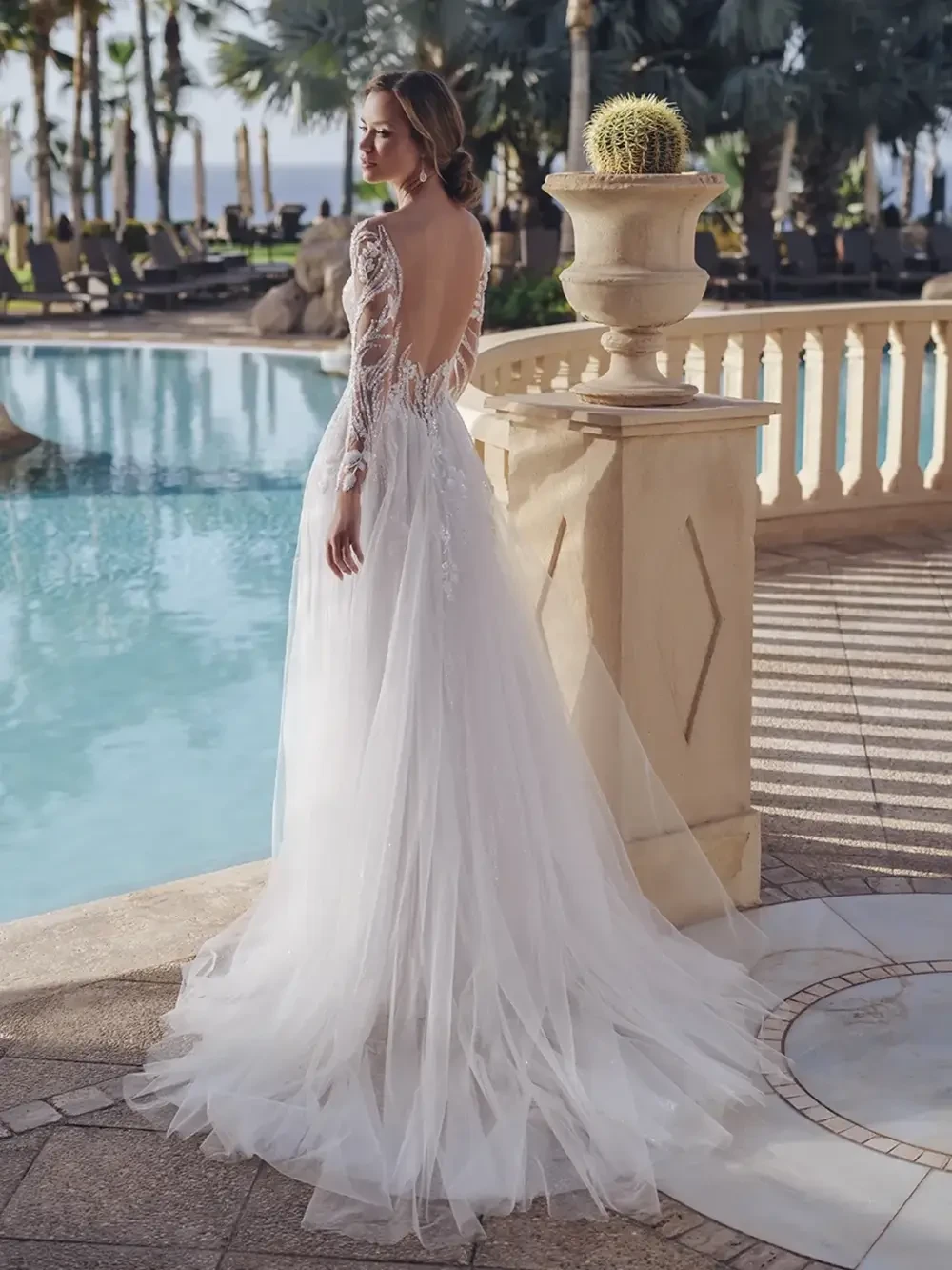model is wearing an elaborate bridal gown