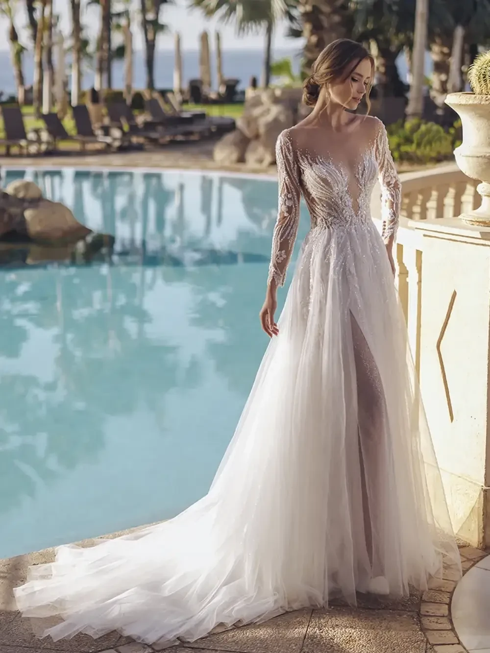 model is wearing an elaborate bridal gown